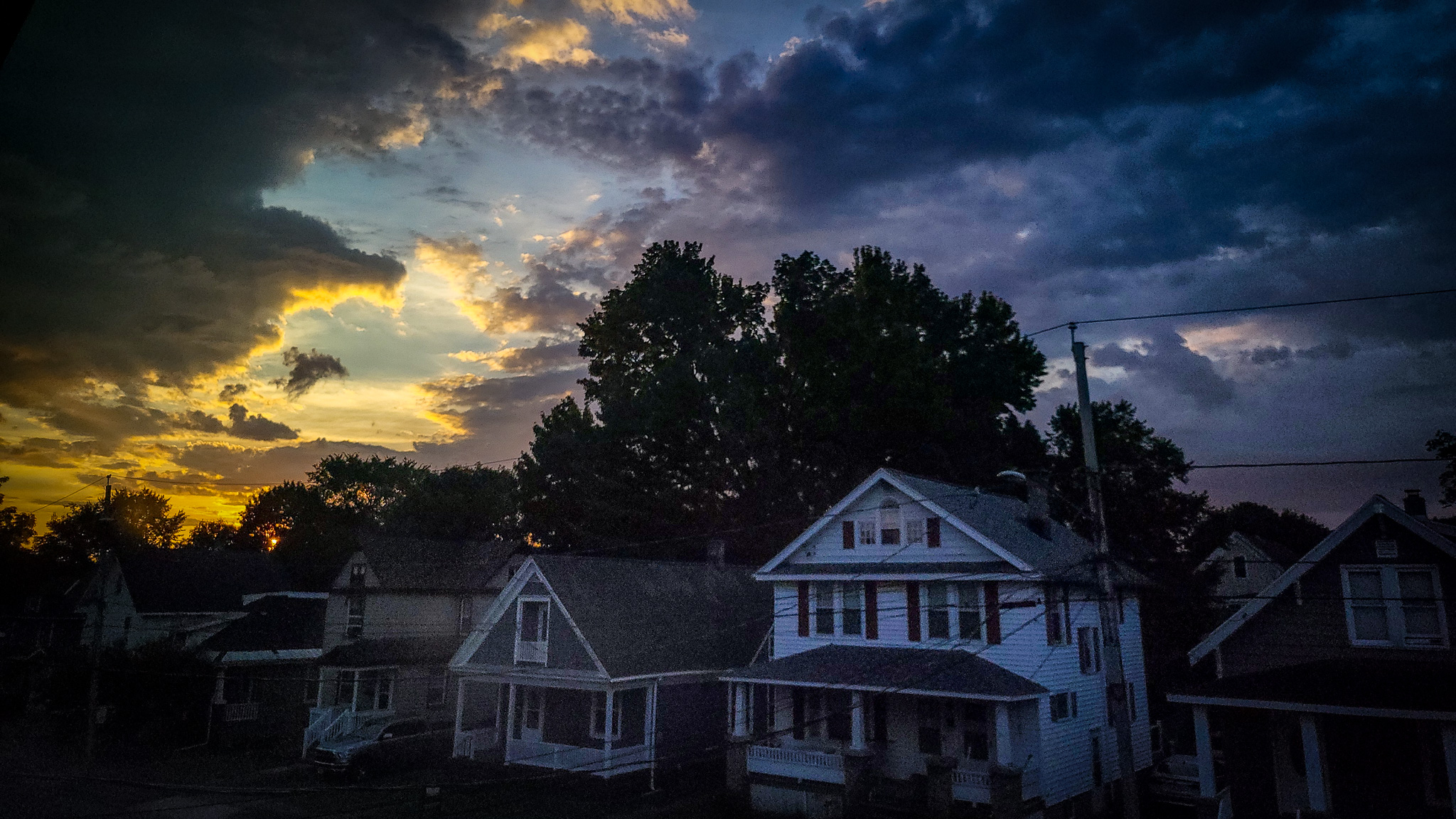 sunrise over row of houses